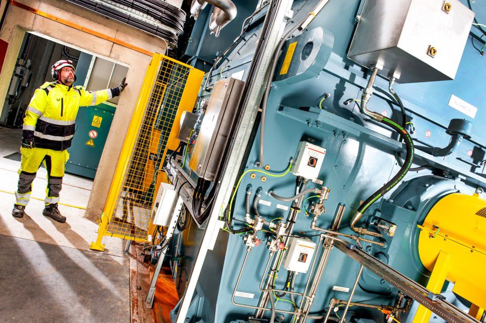 Worker inside grid services substation