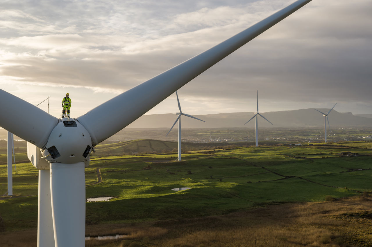 Worker on top of wind turbine at Acres wind farm